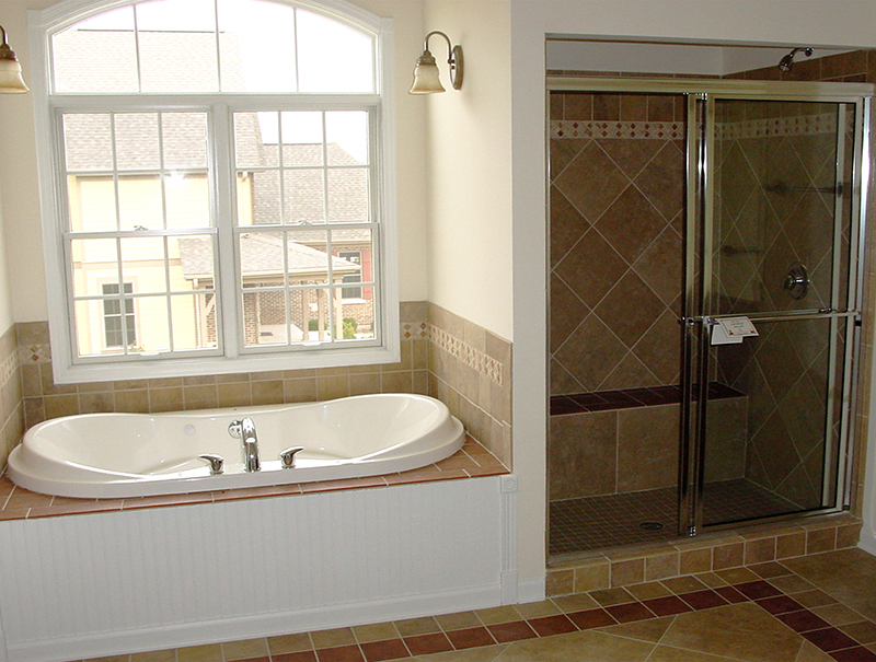 beige tiled bathroom full view