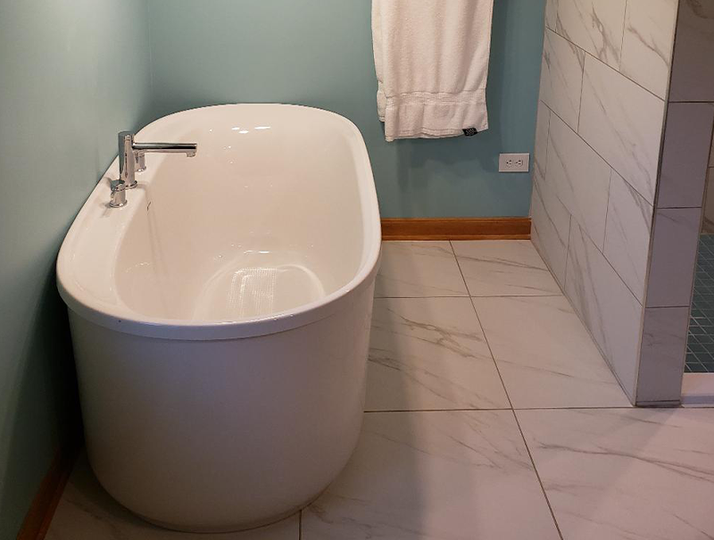 Angled look into the freestanding tub for better idea of depth of the basin.